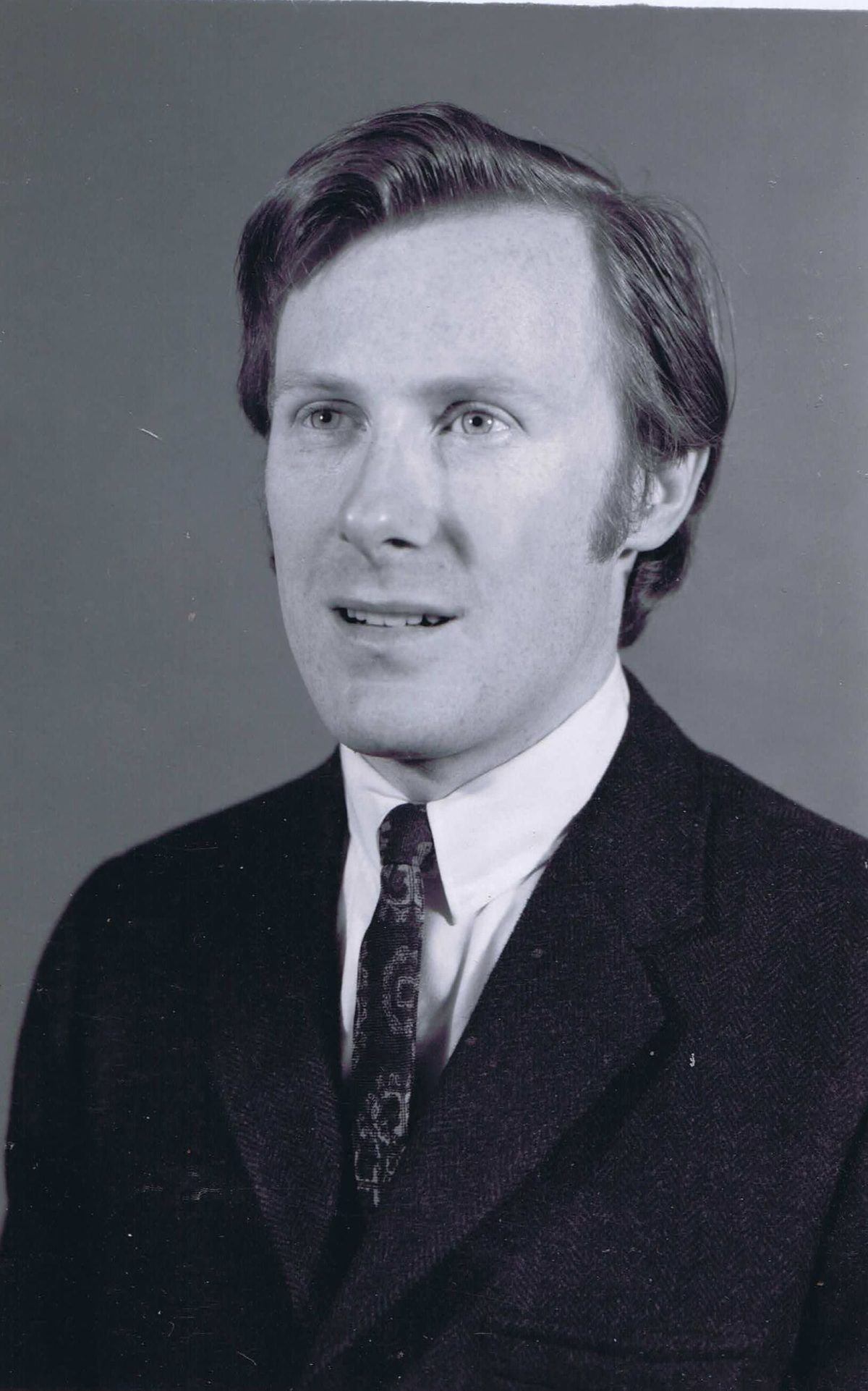A black and white portrait of Frank Davey